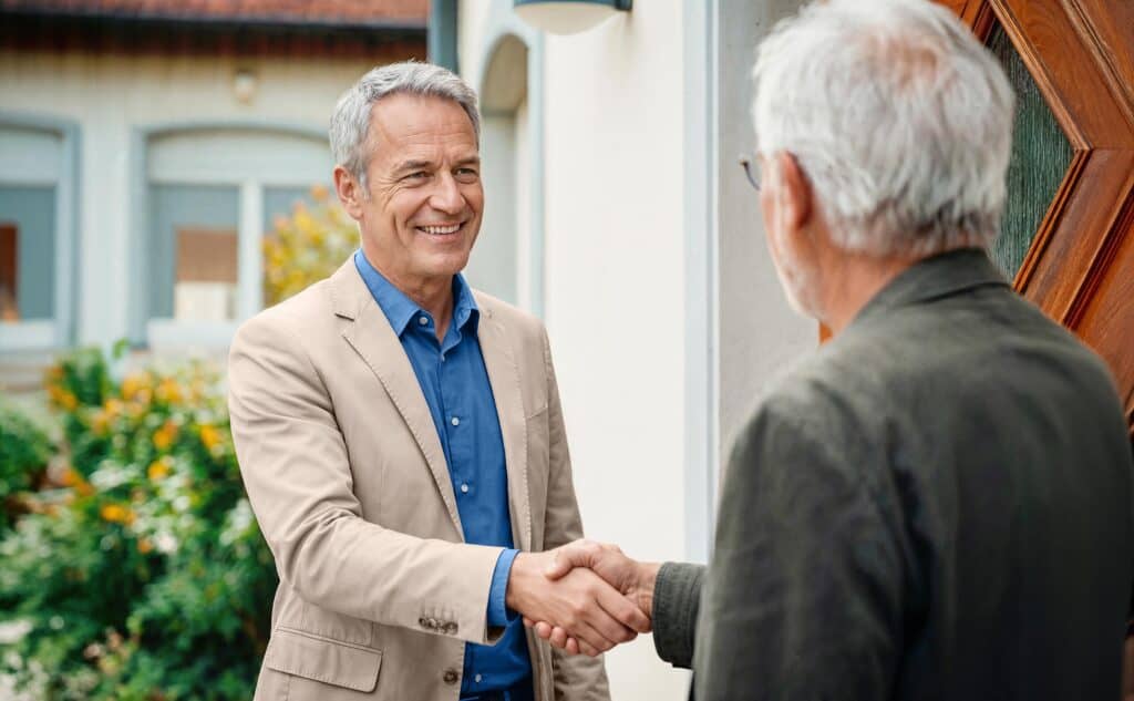 Male Dovida agent shaking hands with a client